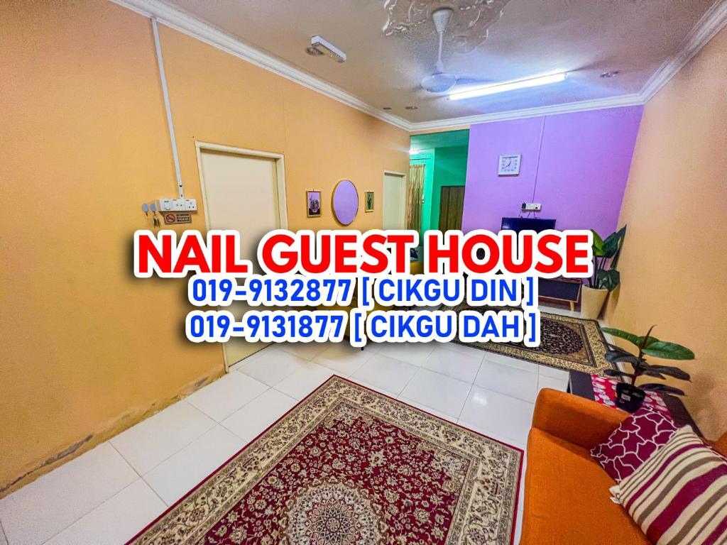 a room with a wall with a sign that reads nail guest house at Nail Guest House Kuala Besut in Kampong Nail