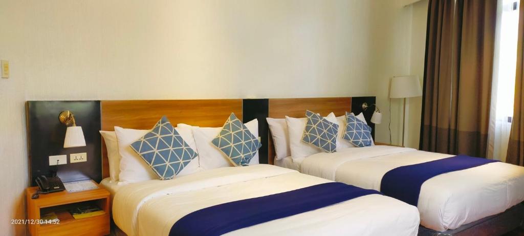 Postel nebo postele na pokoji v ubytování Chateau Bleu Resort