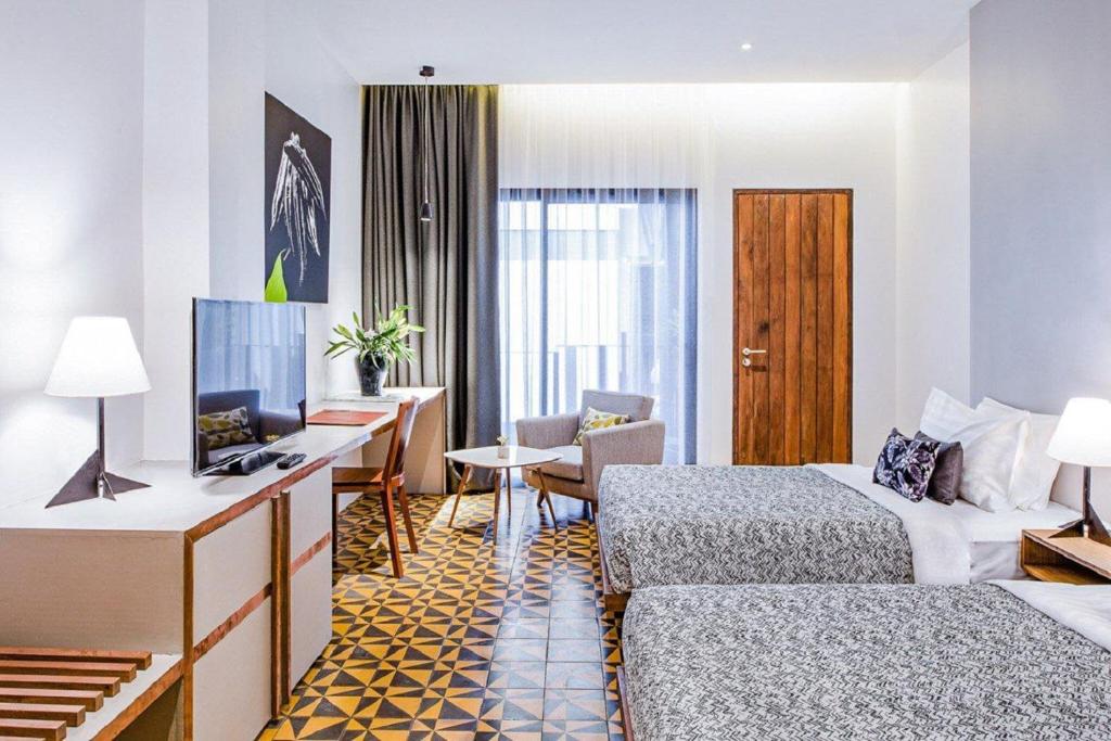 TV a/nebo společenská místnost v ubytování Atelier Hotel