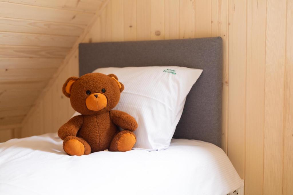 Postel nebo postele na pokoji v ubytování Resort Za Lasem
