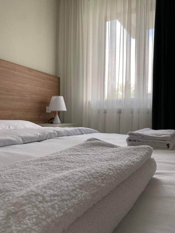 Postel nebo postele na pokoji v ubytování ECO PARK RESORT