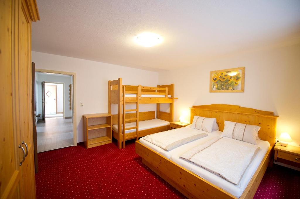 Krevet ili kreveti u jedinici u okviru objekta Chalet & Apartments Tiroler Bua