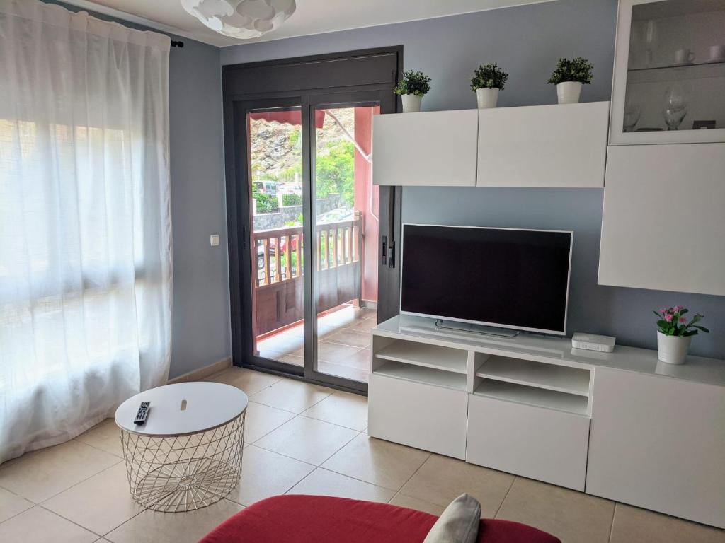 Televízia a/alebo spoločenská miestnosť v ubytovaní Espacioso apartamento de 2 dormitorios