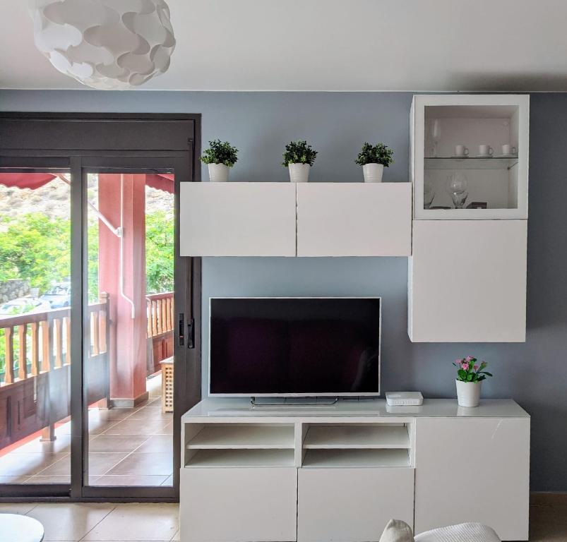 Televízia a/alebo spoločenská miestnosť v ubytovaní Espacioso apartamento de 2 dormitorios