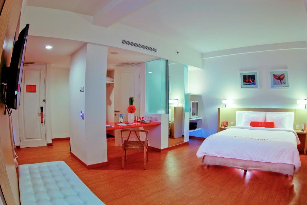 Ein Bett oder Betten in einem Zimmer der Unterkunft HARRIS Hotel & Conventions Malang