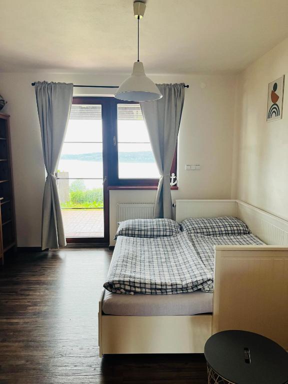 Postel nebo postele na pokoji v ubytování Apartmán Plachetnice