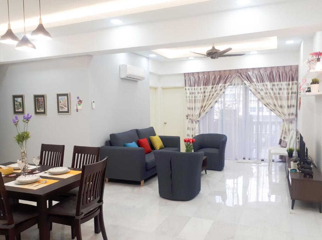 a living room with a couch and a table at The FORUM condominium, Jalan Inai, Off Jalan Tun Razak in Kuala Lumpur