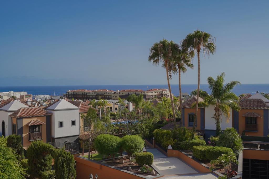 a view of a city with palm trees and buildings at Beautiful El Duque in Adeje