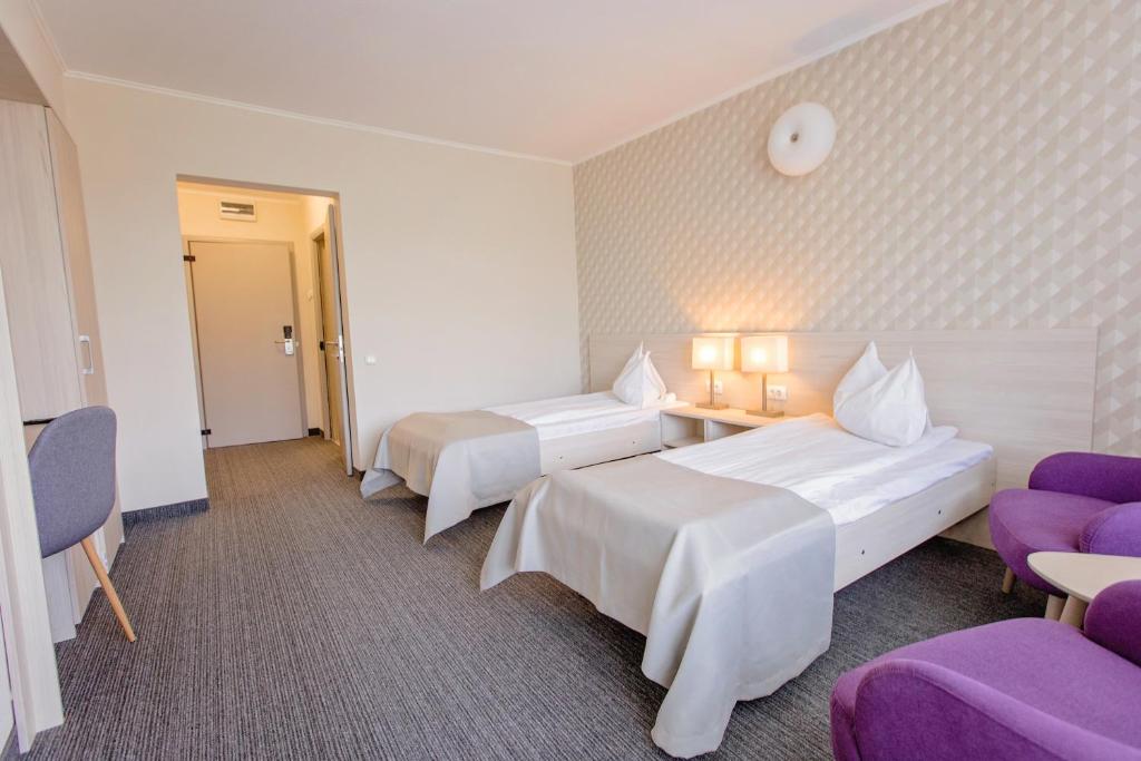 Postel nebo postele na pokoji v ubytování Hotel Termal