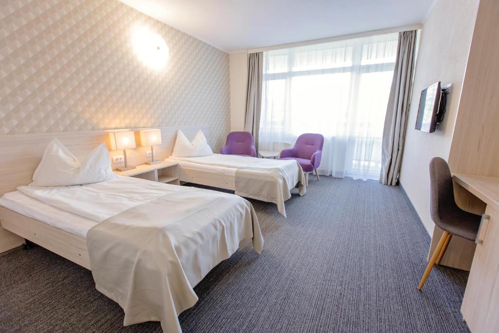 Postel nebo postele na pokoji v ubytování Hotel Termal