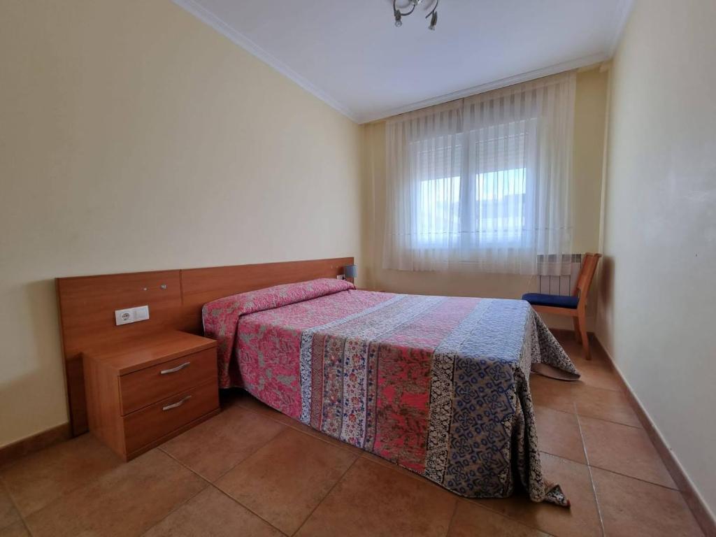 Postel nebo postele na pokoji v ubytování Apartamento en Playa Rapadoira
