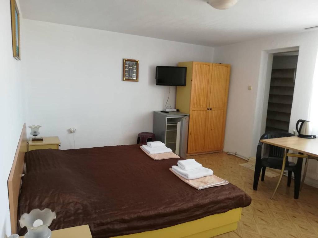 Postel nebo postele na pokoji v ubytování Guest House Dimi