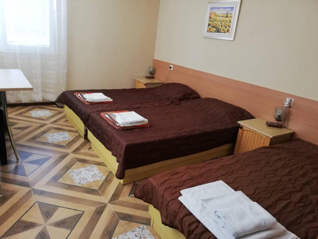 Postel nebo postele na pokoji v ubytování Guest House Dimi