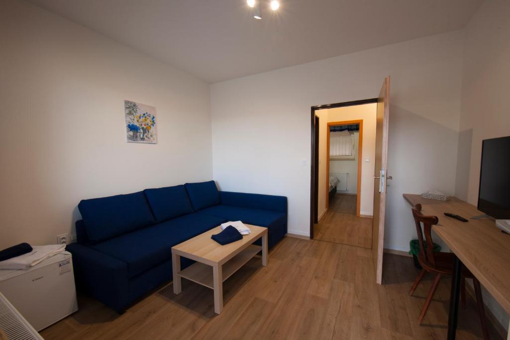 A television and/or entertainment centre at Penzion POSADA