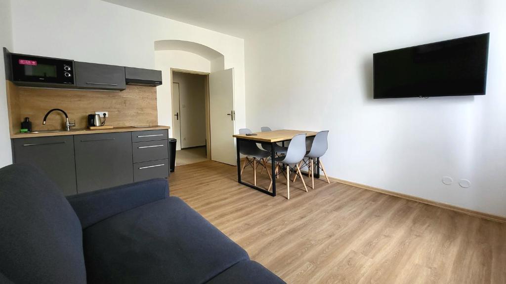 Kuchyň nebo kuchyňský kout v ubytování Apartmány hotelu Ostrý
