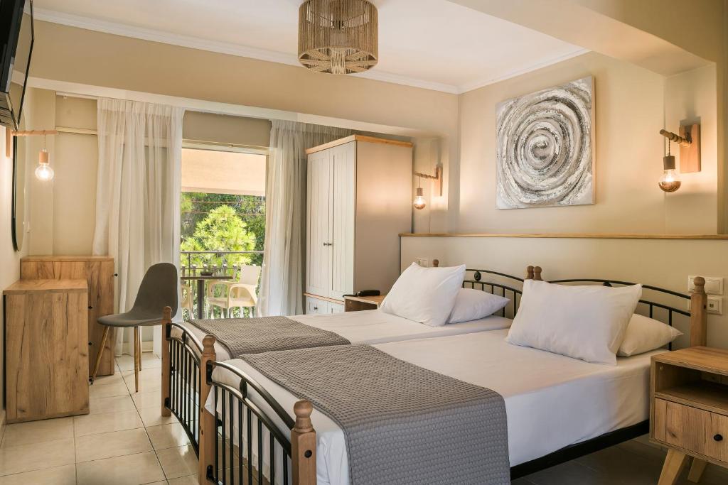 Postel nebo postele na pokoji v ubytování Irilena Hotel