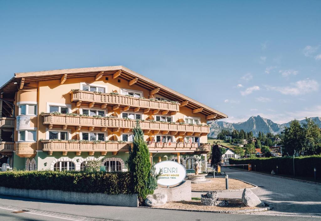 a large building on the side of a road at HENRI Country House Seefeld in Seefeld in Tirol
