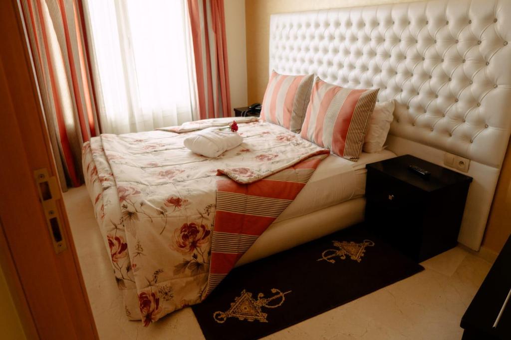 Postel nebo postele na pokoji v ubytování Hotel La Luna