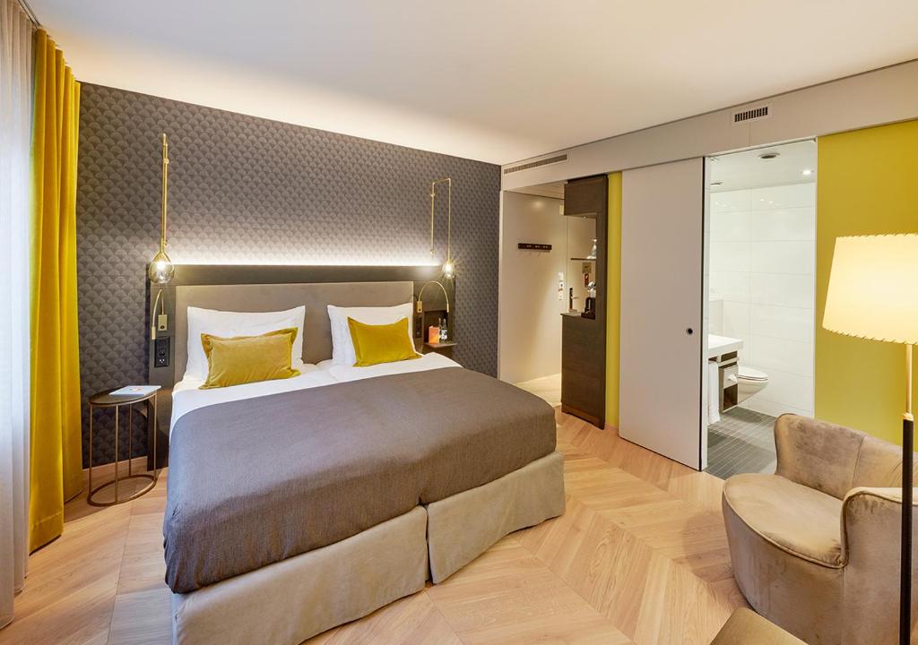 Postel nebo postele na pokoji v ubytování Boutique Hotel Seefeld
