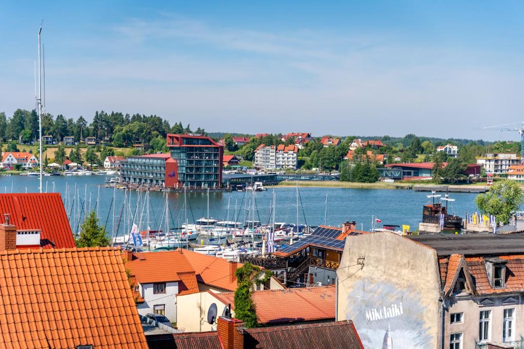 a view of a harbor with boats in the water at Apartament z Widokiem in Mikołajki