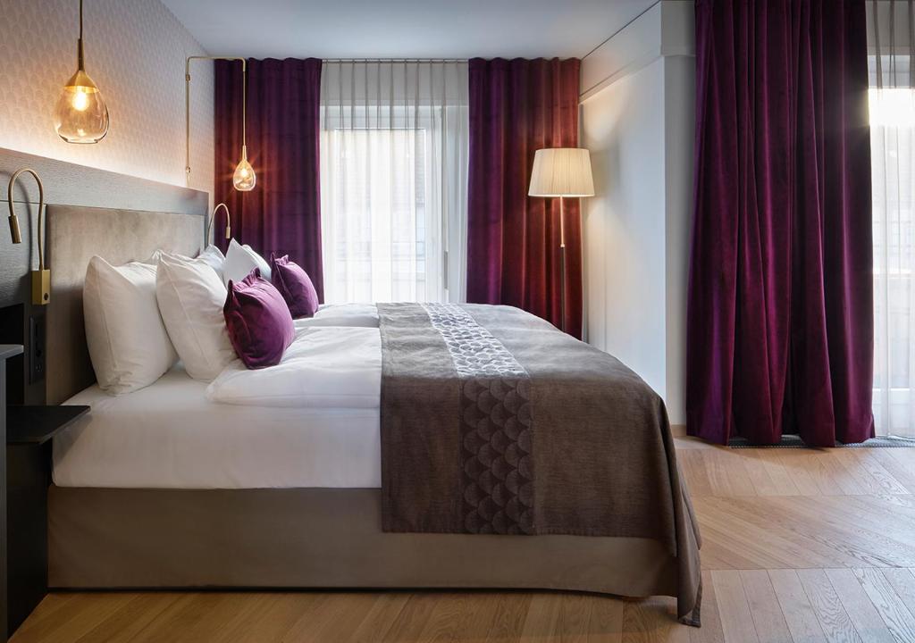 Postel nebo postele na pokoji v ubytování Boutique Hotel Seefeld
