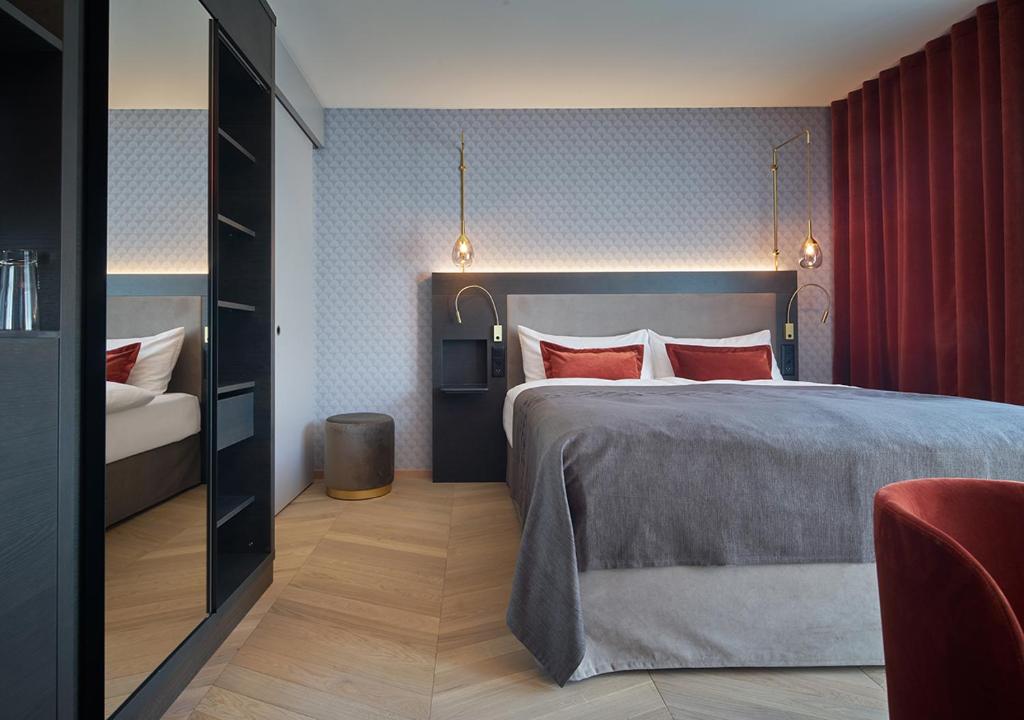 Postel nebo postele na pokoji v ubytování Boutique Hotel Seefeld