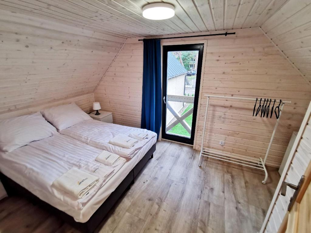 Postel nebo postele na pokoji v ubytování Ośrodek Wypoczynkowy Merkury