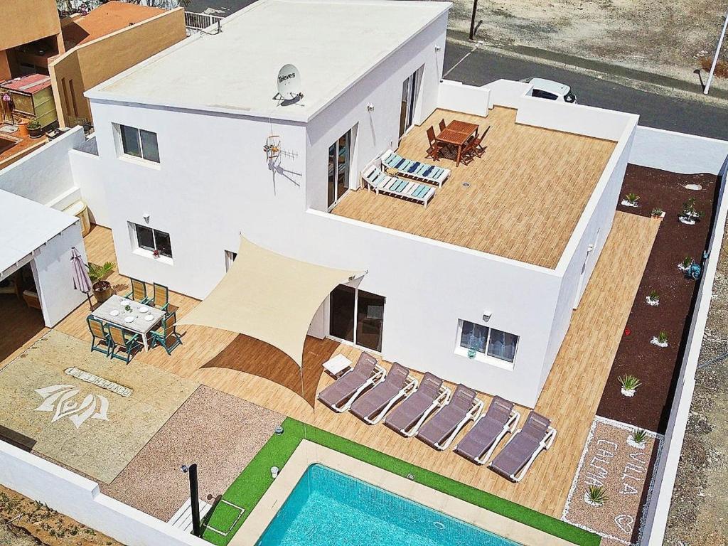 an aerial view of a house with a swimming pool at Villa Calma Climatized pool Private Jacuzzi Spa in Tarajalejo in Tuineje