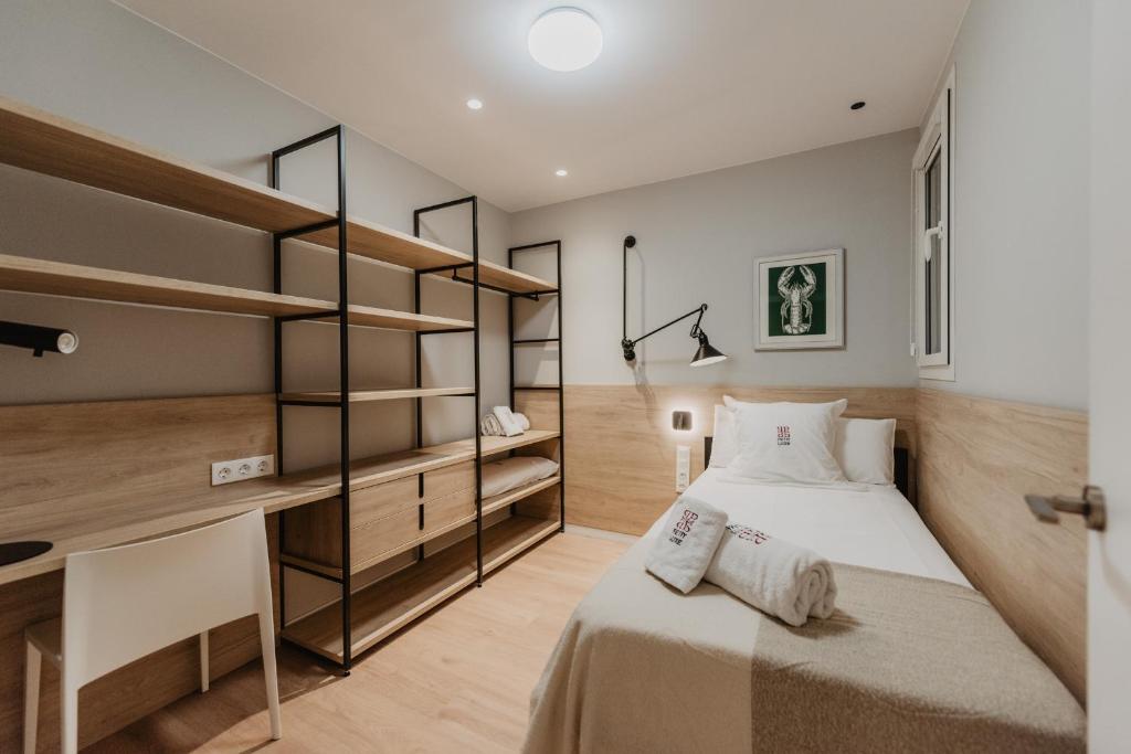 Postel nebo postele na pokoji v ubytování Petit Luxe Volta Apartaments