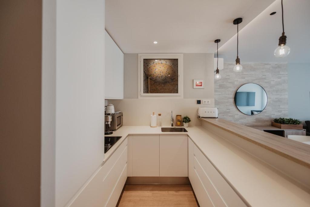 Kuchyň nebo kuchyňský kout v ubytování Petit Luxe Volta Apartaments