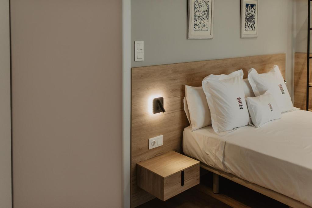 Postel nebo postele na pokoji v ubytování Petit Luxe Volta Apartaments