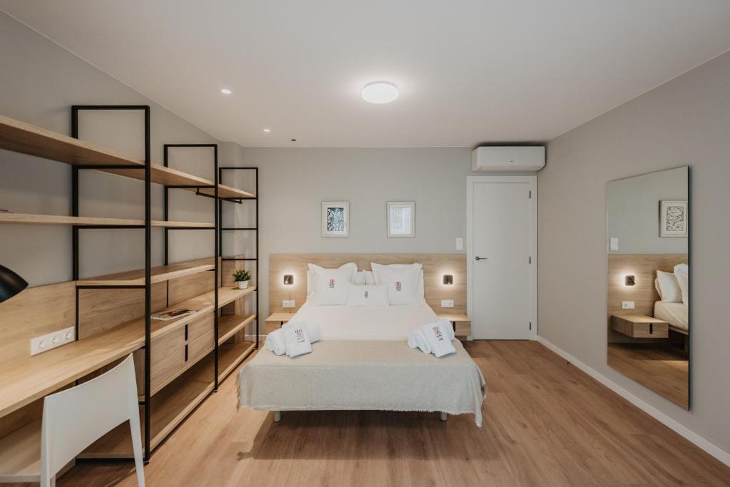 Postel nebo postele na pokoji v ubytování Petit Luxe Volta Apartaments