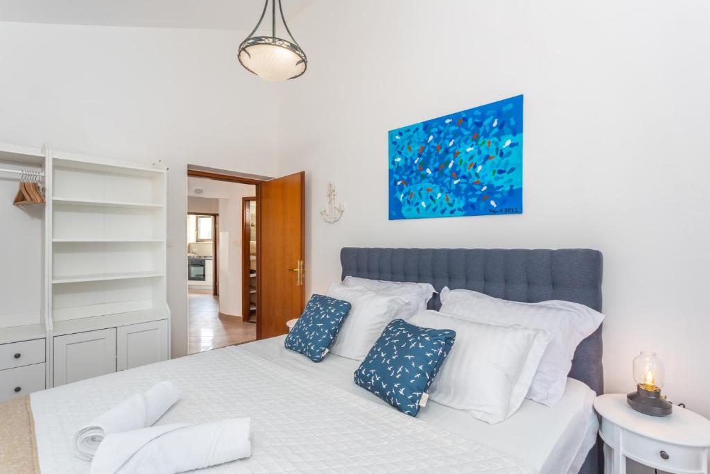 Łóżko lub łóżka w pokoju w obiekcie Apartment Vita Lovran