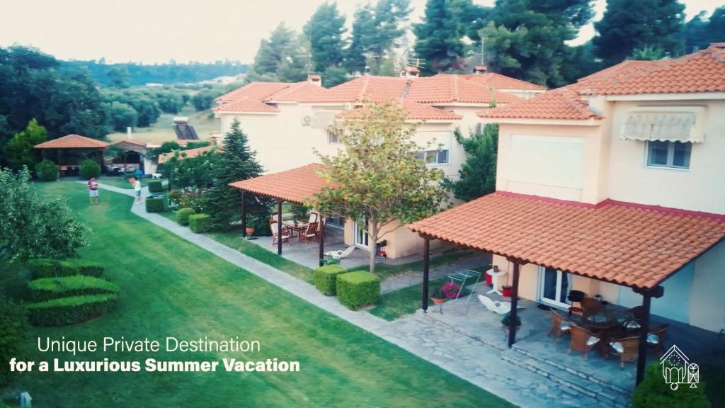 an overhead view of a house with a yard at Cookoo Villas in Kriopigi