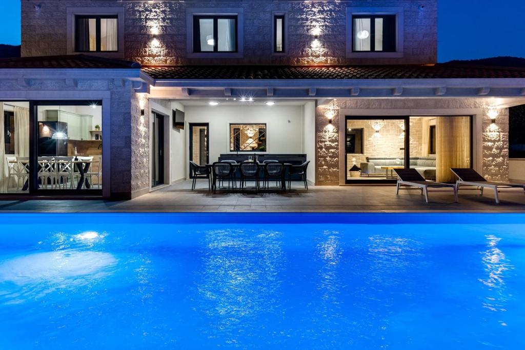 NEW! Stylish Villa Neven with 44sqm heated private pool, 4 en-suite bedrooms, 2 living and dining areas, wine cellar