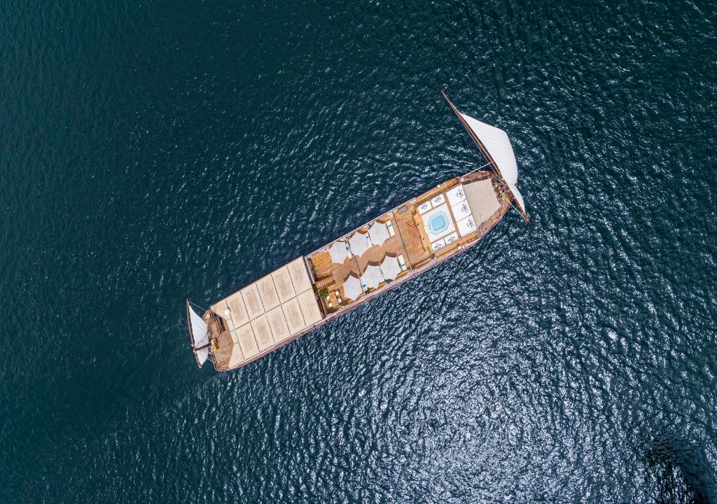 an aerial view of a boat in the water at Dahabeya Molouky Nile Cruise- Every Monday from Luxor- Aswan for 05 nights in Luxor