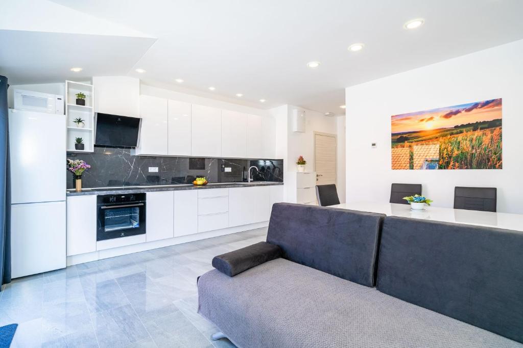 Kuchyň nebo kuchyňský kout v ubytování Andelic Sunset Apartments