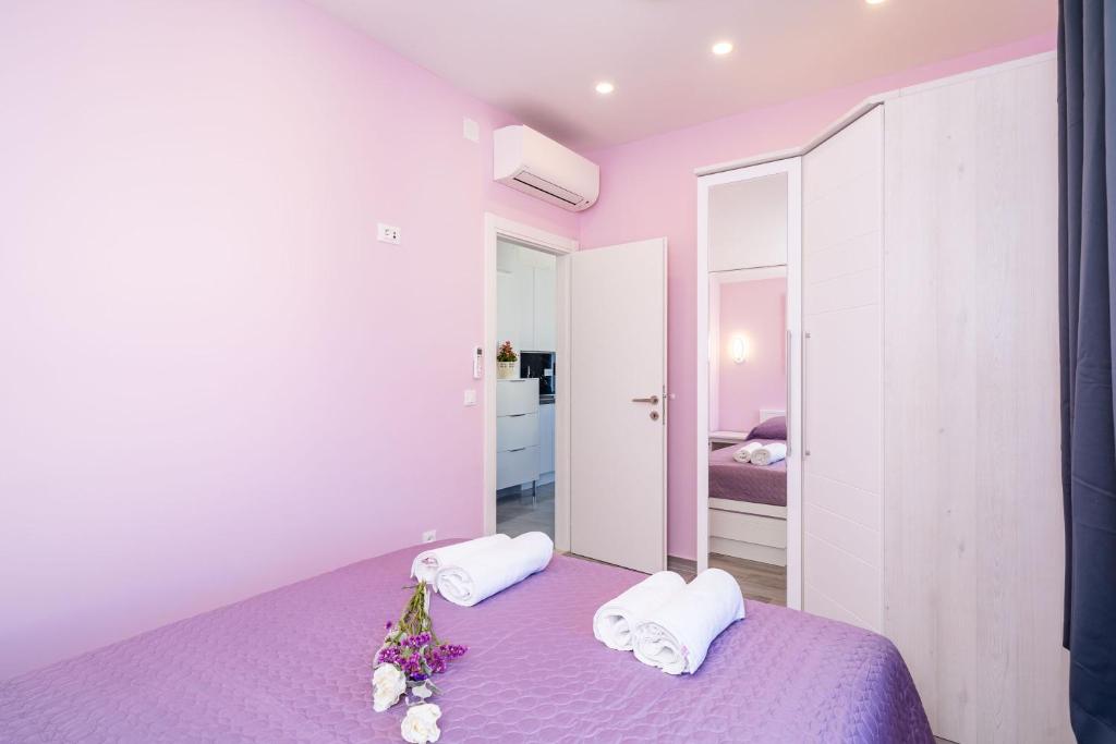 Postel nebo postele na pokoji v ubytování Andelic Sunset Apartments