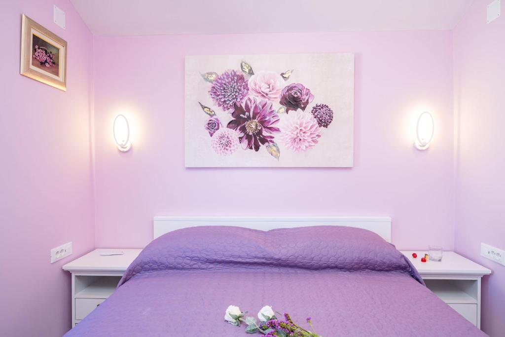 Postel nebo postele na pokoji v ubytování Andelic Sunset Apartments