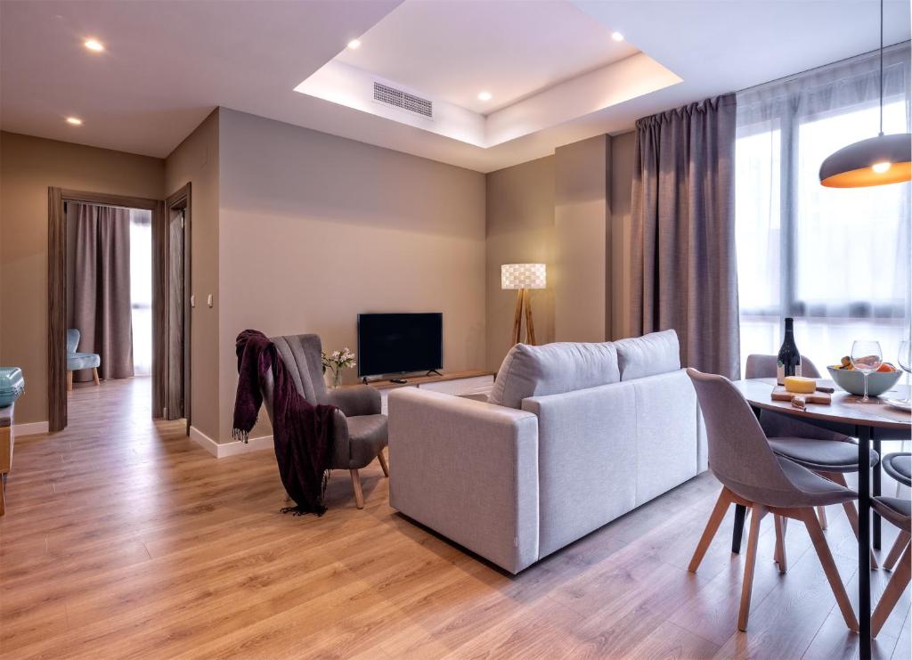 TV a/nebo společenská místnost v ubytování Dauria Suites HA