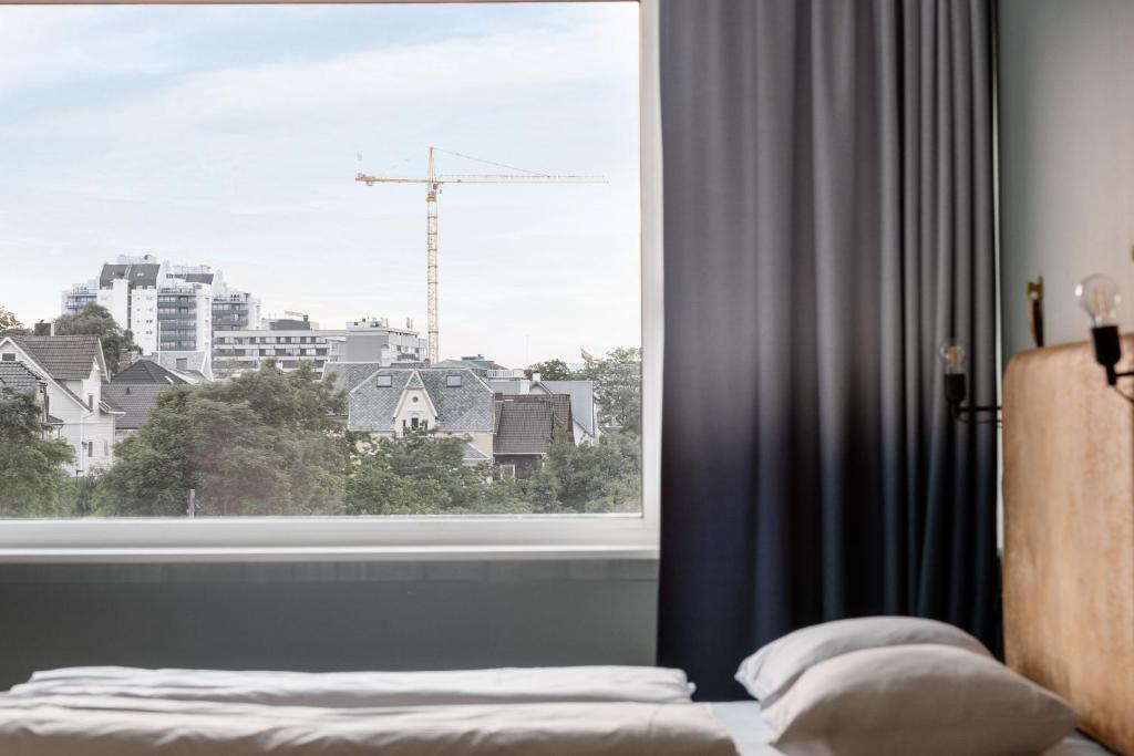 Postel nebo postele na pokoji v ubytování Bjørvika Apartments - Sirkus Renaa