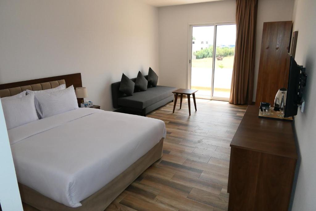 Postel nebo postele na pokoji v ubytování Hôtel Corail de Cabo
