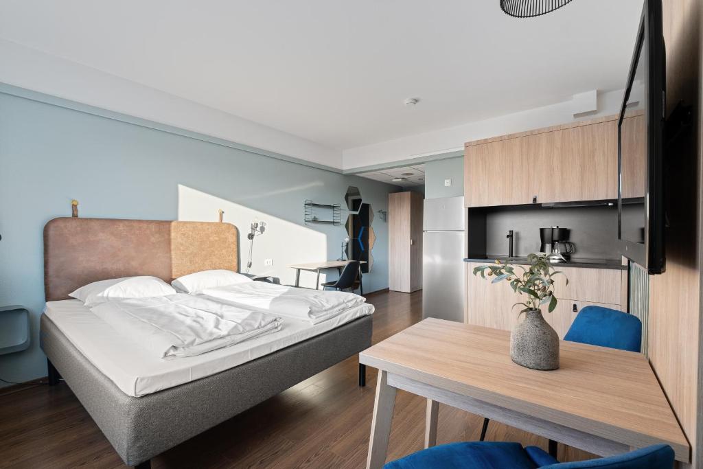 Postel nebo postele na pokoji v ubytování Bjørvika Apartments - Sirkus Renaa