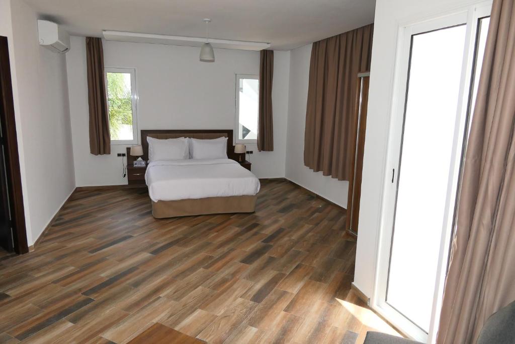 Postel nebo postele na pokoji v ubytování Hôtel Corail de Cabo