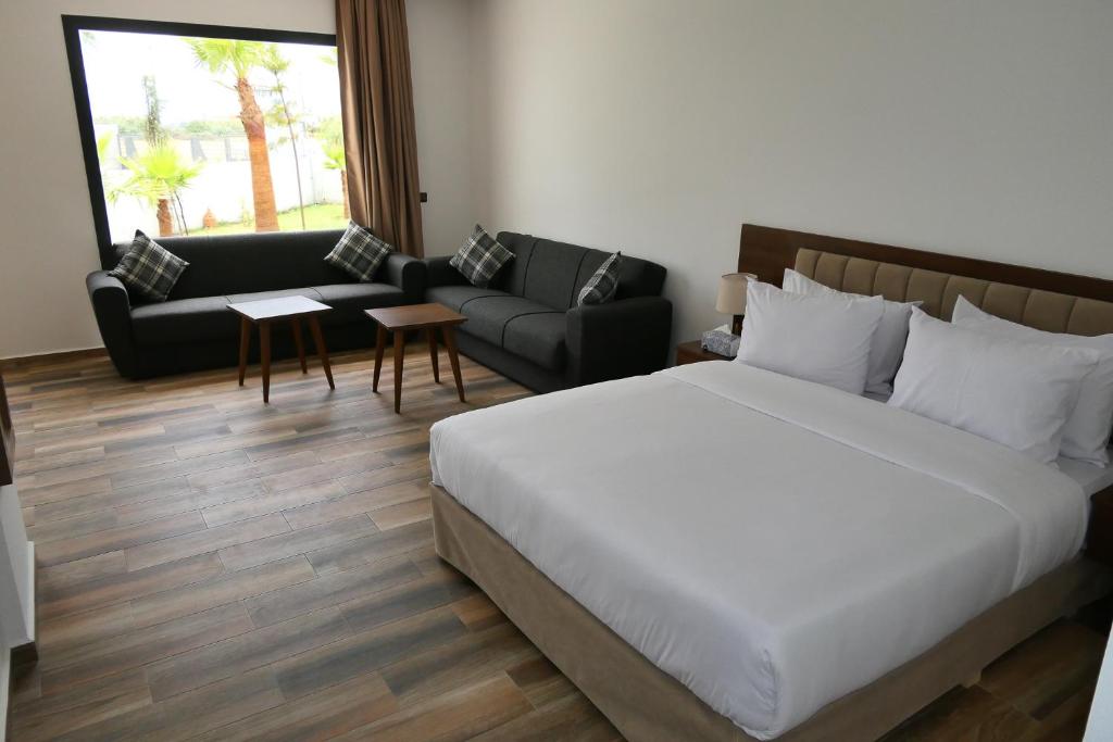 Postel nebo postele na pokoji v ubytování Hôtel Corail de Cabo