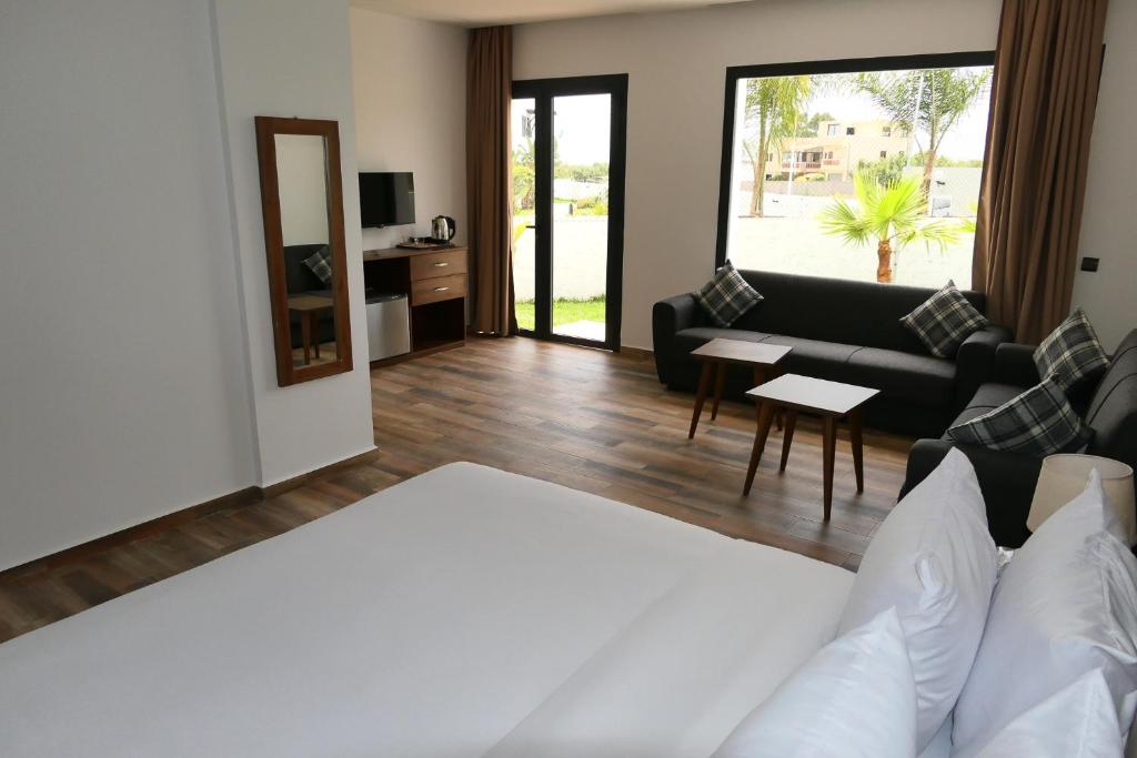 Postel nebo postele na pokoji v ubytování Hôtel Corail de Cabo