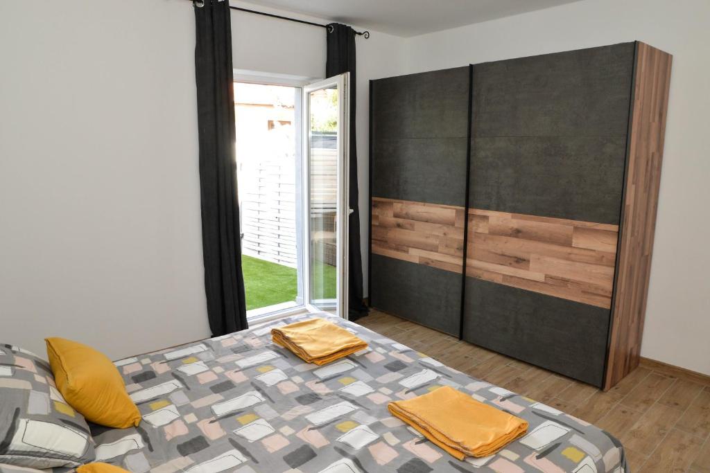 Posteľ alebo postele v izbe v ubytovaní Apartman Nina 3