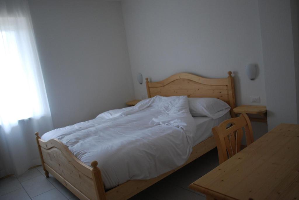 Postel nebo postele na pokoji v ubytování Hotel Elbele Garnì