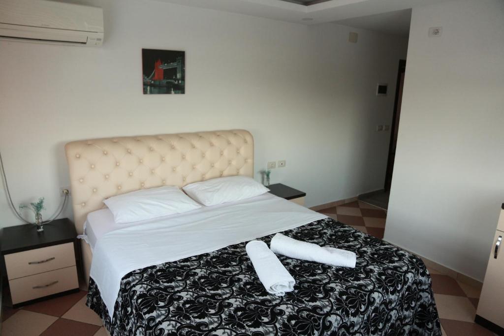 Postel nebo postele na pokoji v ubytování Hotel Fantazia