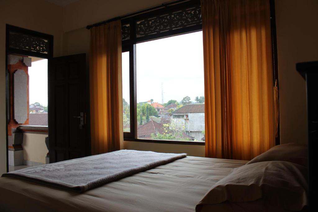 Postel nebo postele na pokoji v ubytování Tutick House